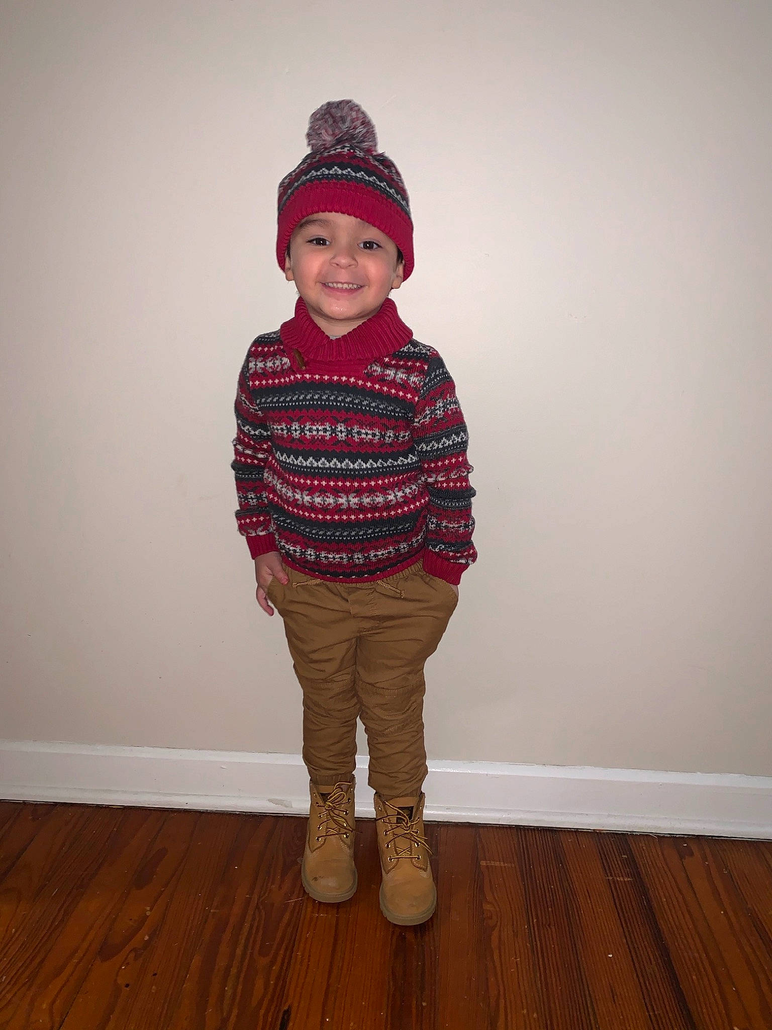 Enrique joined the competition — help win amazing prizes! baby_toddler_clothing, cap, face, flooring, grey, happy, hardwood, headwear, joy, laminate_flooring, magenta, neck, pattern, person, plank, sleeve, smile, standing, toddler, varnish