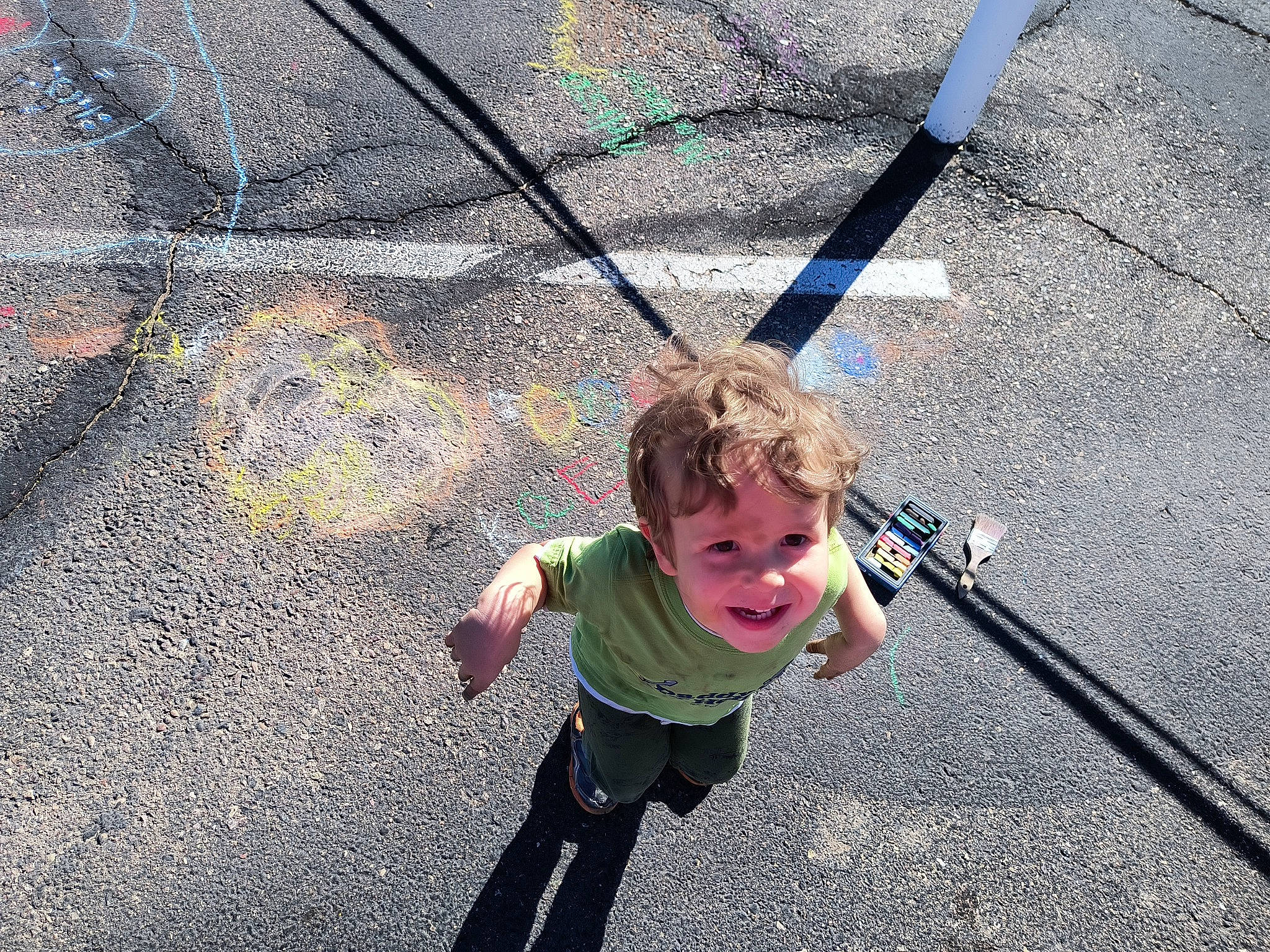 Donald is registered to the contest to win money with this photo: adventure, asphalt, child, city, concrete, fun, grass, happy, head, leisure, outdoor_play_equipment, outdoor_recreation, person, play, recreation, road_surface, rope, shadow, sidewalk, t_shirt