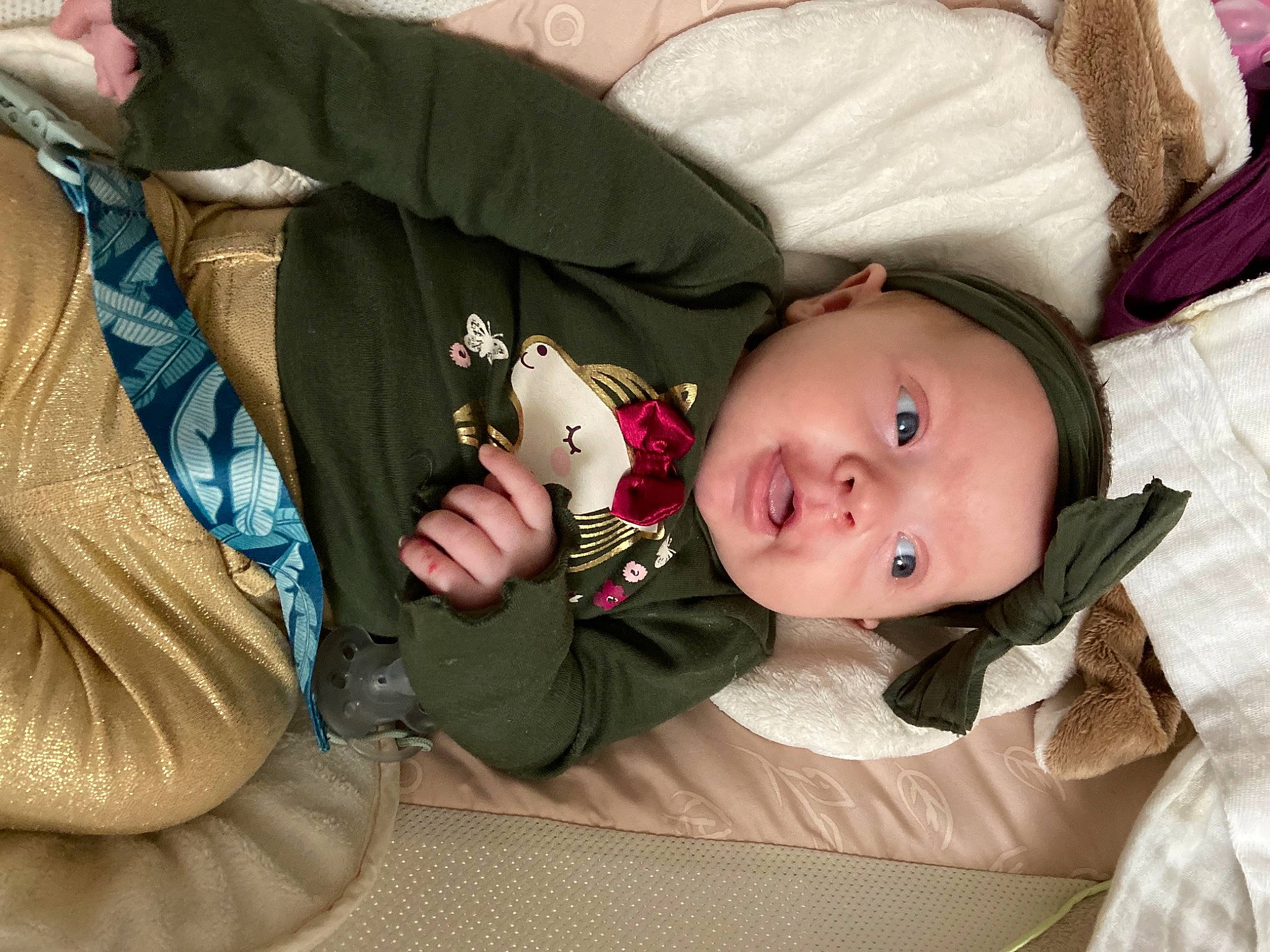 Harper is registered to the contest to win money with this photo: baby, baby_products, baby_toddler_clothing, cheek, child, comfort, eye, face, finger, head, human, lap, linens, mammal, mouth, person, sitting, skin, sleeve, textile