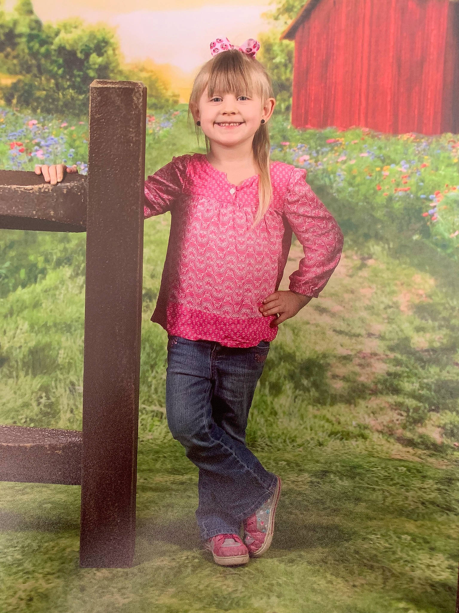 Bria is registered to the contest to win money with this photo: brown_hair, child, child_model, fun, grass, green, jeans, joy, long_hair, pattern, person, photography, pink, plant, play, smile, standing, t_shirt, toddler, tree
