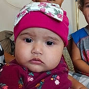 Rain joined the competition — help win amazing prizes! baby, child, indoor, hat, pink, bow, curious, face, person, clothing, sitting, portrait, expression, young_child, baby_girl, candid, cute, people, family, closeup