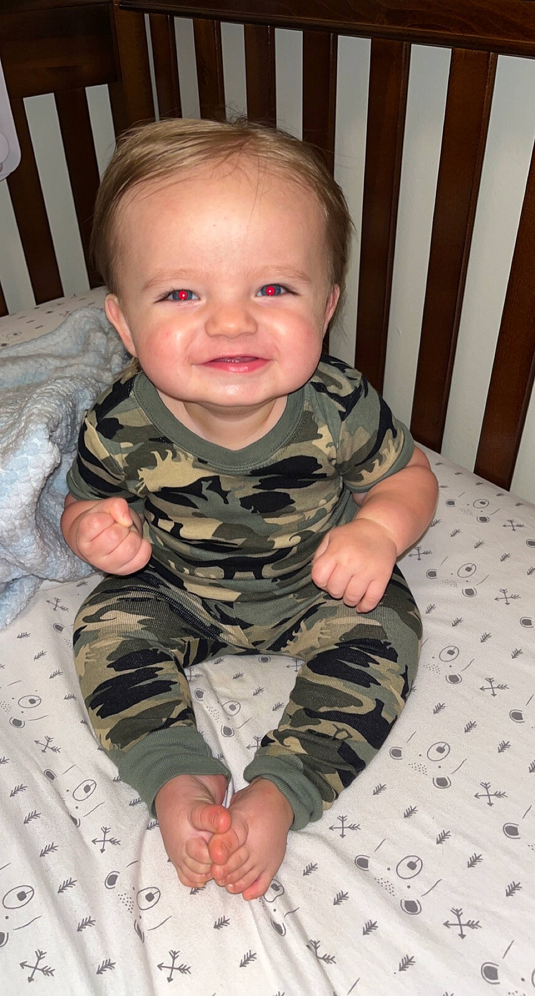 Xavier joined the competition — help win amazing prizes! arm, baby, baby_toddler_clothing, camouflage, cheek, comfort, eye, face, gesture, head, iris, joy, military_camouflage, mouth, neck, nose, outerwear, person, skin, sleeve