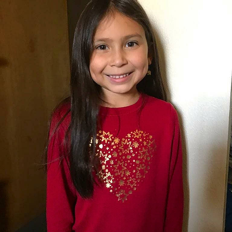 Ally is registered to the contest to win money with this photo: black_hair, blouse, brown_hair, child_model, forehead, hair, hairstyle, joy, long_hair, neck, outerwear, person, shoulder, sleeve, smile, t_shirt, top