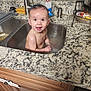 baby, sink, bath, water, kitchen, countertop, smile, happy, child, face, wet, cabinet, tap, cleaning_brush, household, indoor, person, cute, playful, curious