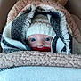 baby, infant, blanket, knitted_hat, pacifier, wrapped, cozy, warm, cute, blue_eyes, soft_texture, child, portrait, closeup, bundle, seat, car_seat, indoors, face, winter