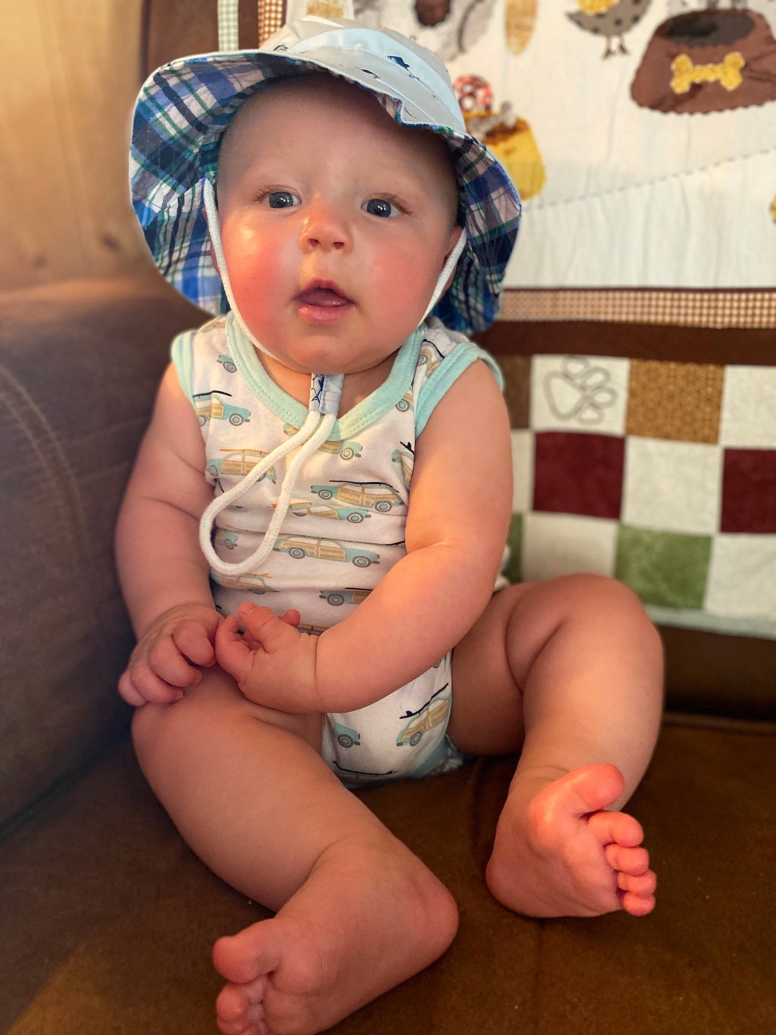 Issac joined the competition — help win amazing prizes! baby, baby_toddler_clothing, cheek, child, hat, headgear, headwear, leg, person, sitting, skin, smile, thigh, toddler