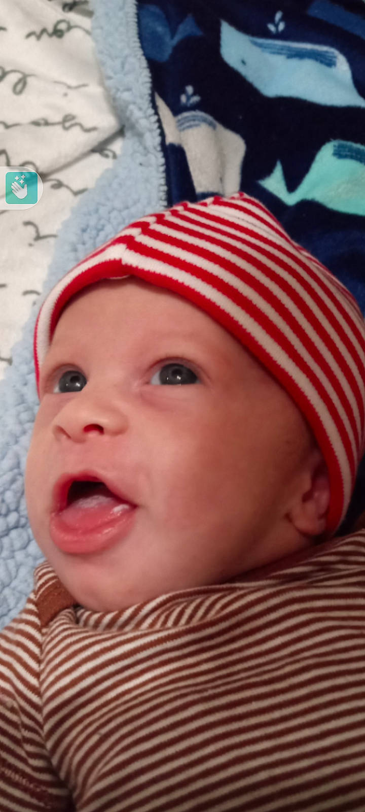 Braxton is registered to the contest to win money with this photo: baby, cap, cheek, close_up, eye, eyebrow, eyelash, fashion_accessory, fun, happy, head, headgear, headwear, knit_cap, lip, mouth, nose, person, pink, skin