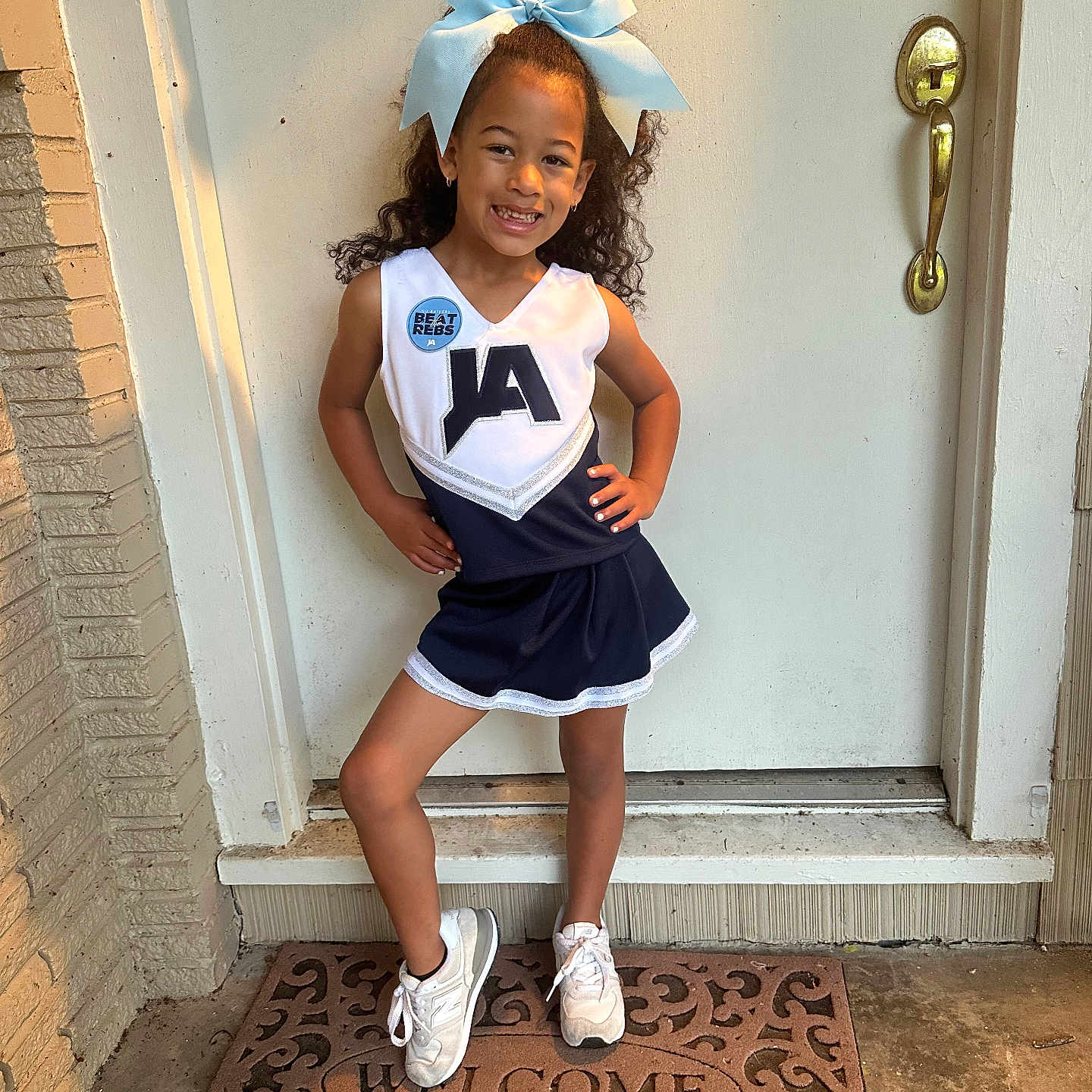 Zaylee joined the competition — help win amazing prizes! child, clothing, face, female, footwear, girl, head, mat, pants, person, photography, portrait, shoe, shorts, sitting, skirt, sleeve, sneaker, standing, student