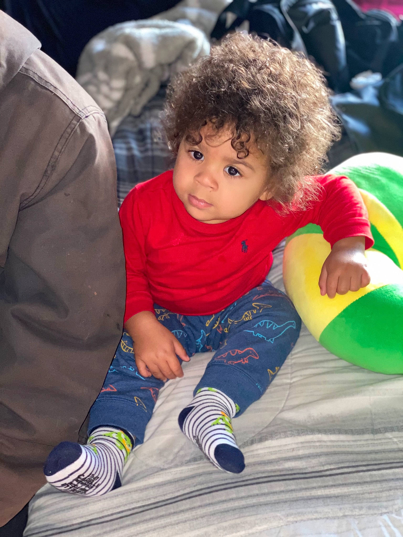 Jorden is registered to the contest to win money with this photo: baby, child, comfort, event, flooring, foot, fun, green, happy, lap, leisure, mammal, person, play, recreation, sand, sitting, thigh, toddler, vacation