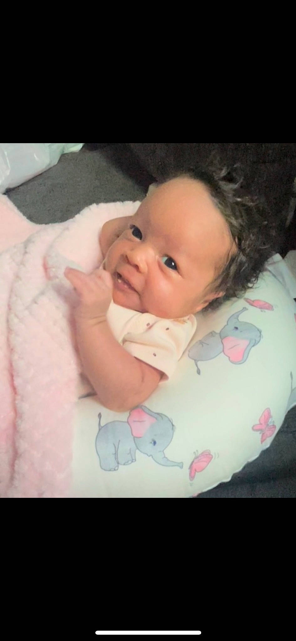 Layla is registered to the contest to win money with this photo: baby, baby_toddler_clothing, cheek, child, chin, comfort, eye, eyebrow, facial_expression, finger, happy, iris, lip, mouth, nose, person, pink, skin, sleeve, smile