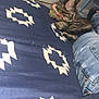Lucy Lee is registered to the contest to win money with this photo: kitten, cat, bedspread, blue, white, pattern, collar, bell, jeans, person, indoor, furniture, door, curious, pet, animal, furry, resting, cozy, soft