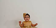 Alexandra joined the competition — help win amazing prizes! baby, child, dress, golden, lace, headband, smile, studio, portrait, sitting, cute, innocent, fashion, elegant, white_background, floor, barefoot, person, indoor, photography
