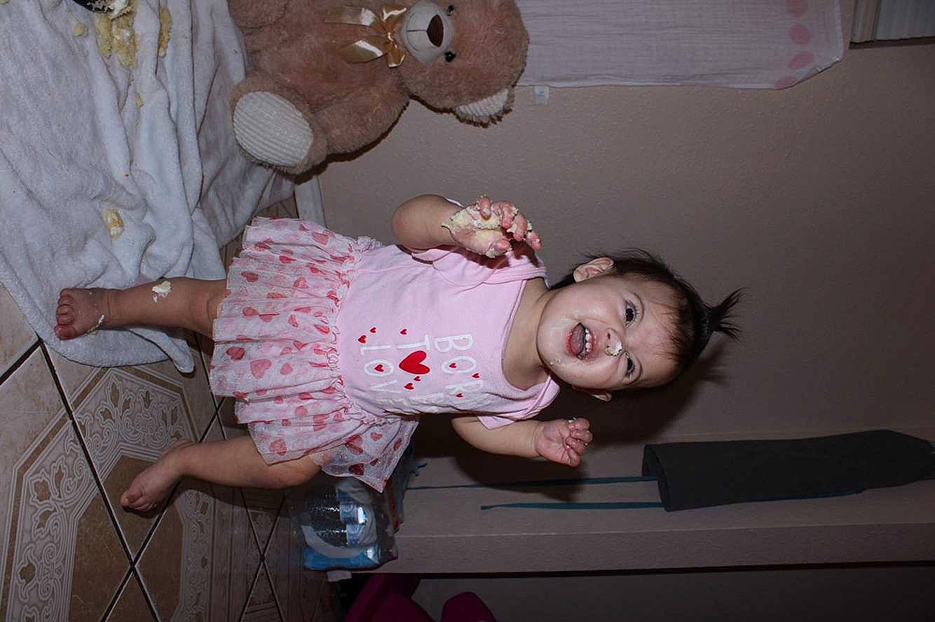 Araya is registered to the contest to win money with this photo: baby, baby_products, baby_toddler_clothing, cheek, child, foot, fun, happy, pattern, person, pink, room, sandal, sitting, skin, toddler