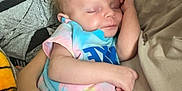 Liana is registered to the contest to win money with this photo: baby, sleeping, infant, blanket, arm, hand, clothing, rest, cozy, person, soft, toddler, cuddle, comfort, indoor, closeup, peaceful, nap, fabric, skin