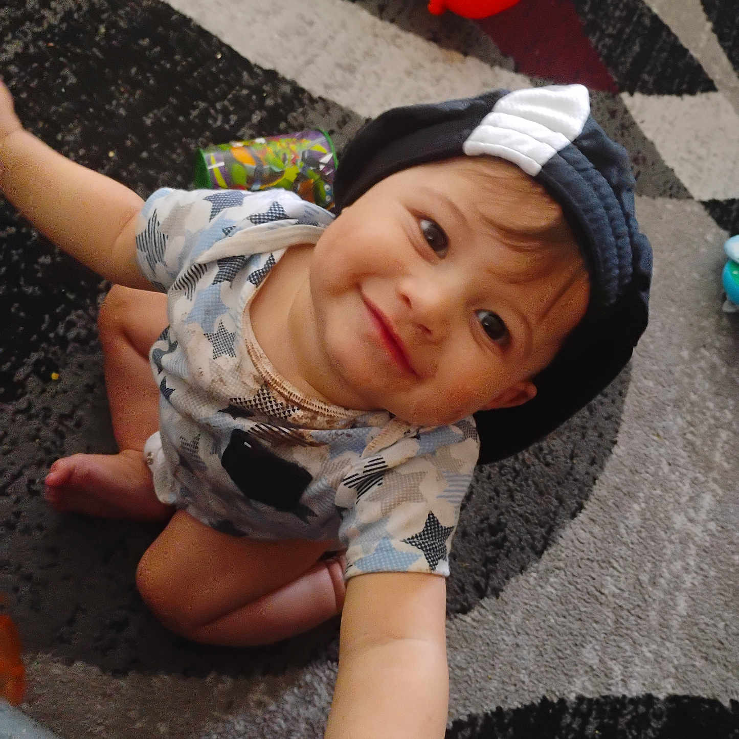 Keyshawn joined the competition — help win amazing prizes! applique, baby, beanie, bodypart, bonnet, cap, clothing, crawling, face, finger, hand, happy, hat, head, person, photography, portrait, sitting, smile, sphere