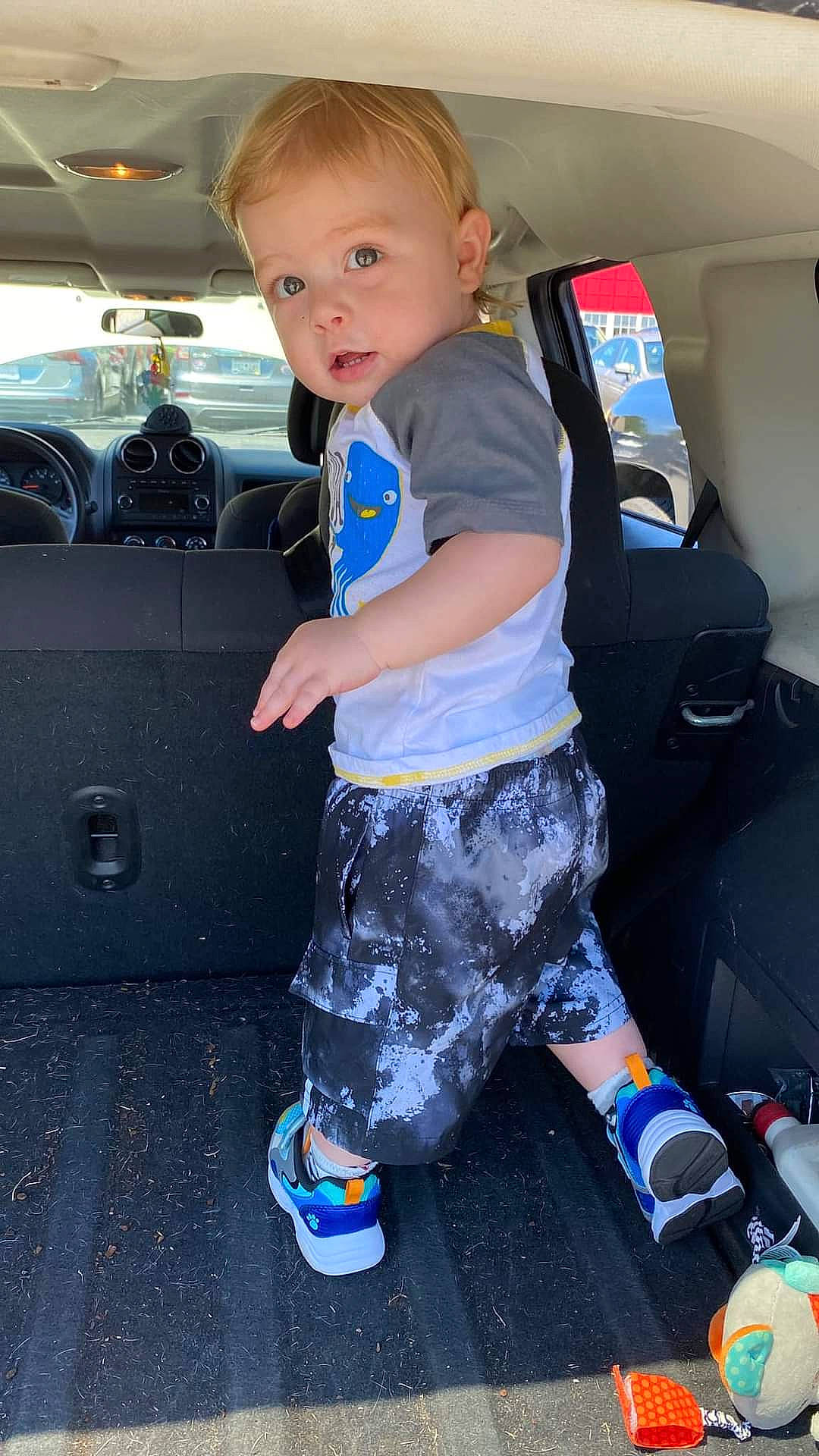 Kayden joined the competition — help win amazing prizes! auto_part, automotive_design, automotive_exterior, automotive_wheel_system, baby_toddler_clothing, bag, bumper, car_seat, child, electric_blue, fun, hair, human_leg, knee, motor_vehicle, person, shoe, sneakers, toddler, travel