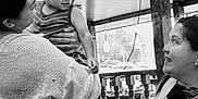 Lorenzo joined the competition — help win amazing prizes! child, woman, smile, indoor, black_and_white, table, glass, napkins, bottle, furniture, holding, happy, people, portrait, casual, clothing, interaction, family, relaxation, candid