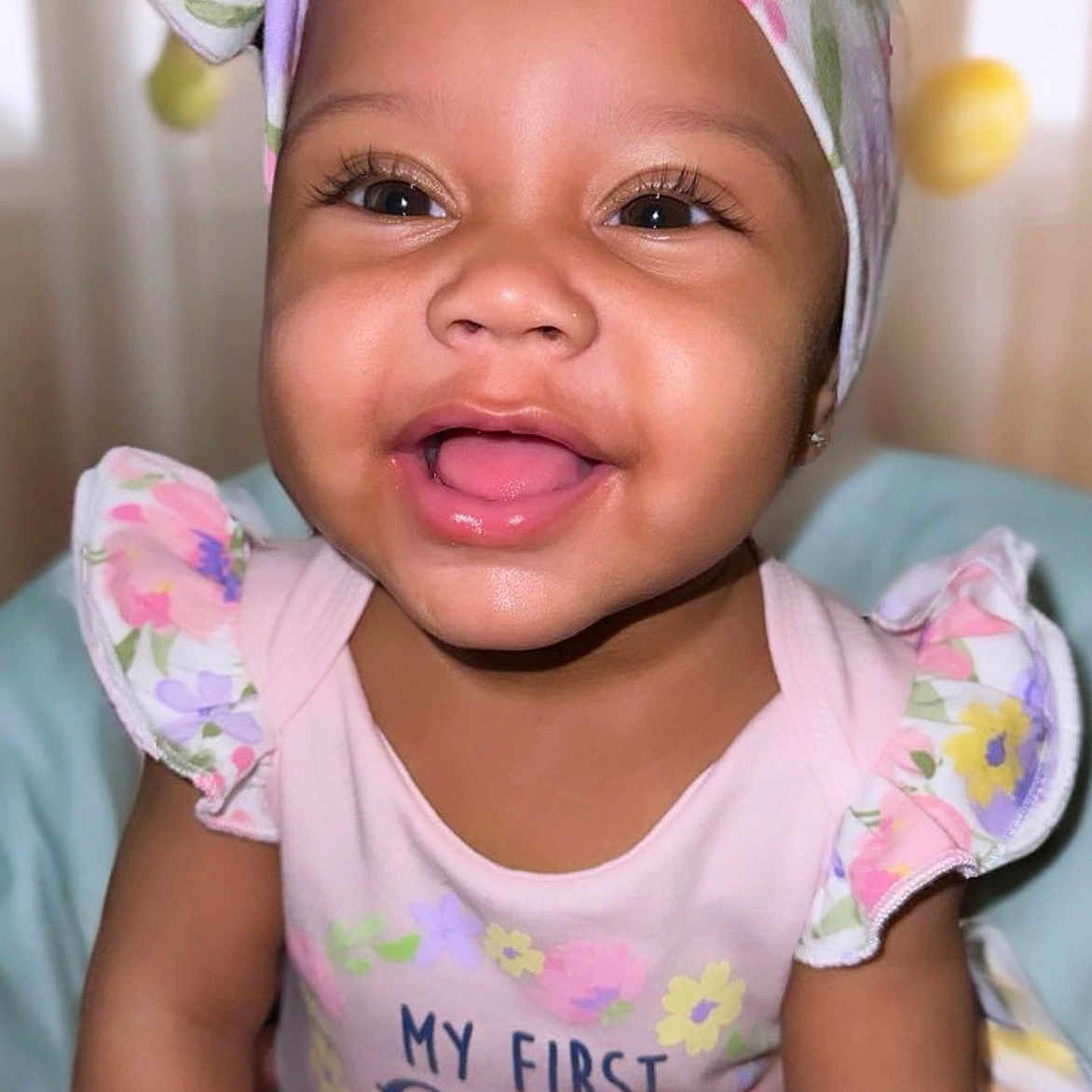 Yamarra is registered to the contest to win money with this photo: baby, babylaughing, bodypart, clothing, face, happy, hat, head, person, photography, portrait, shoulder, smile