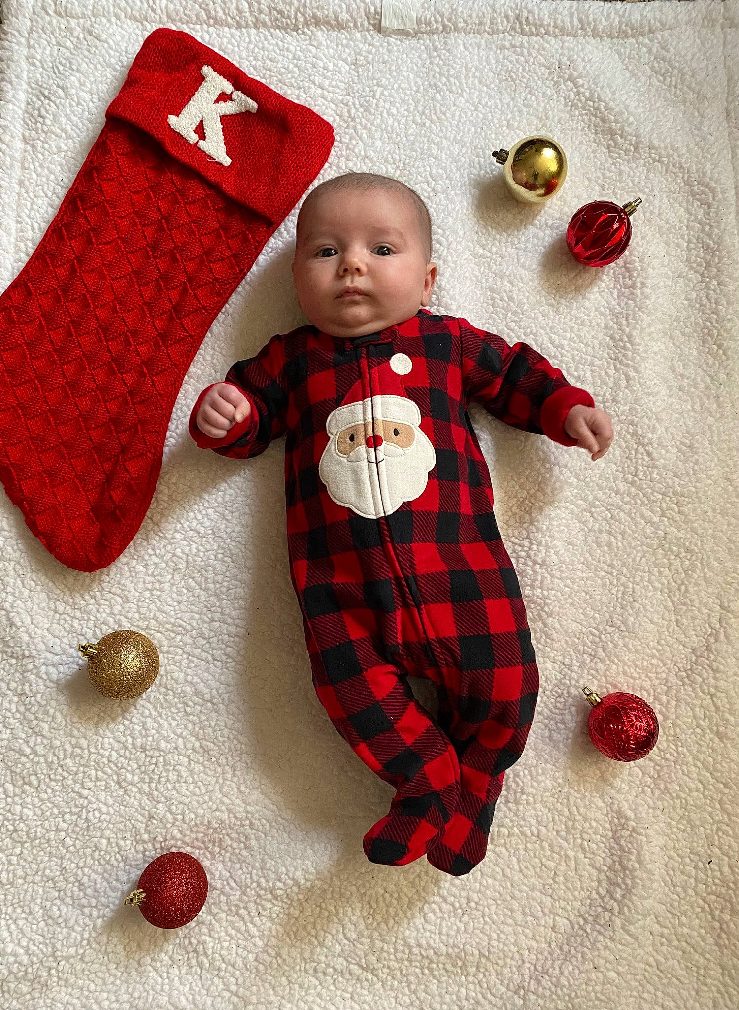 Kahlia joined the competition — help win amazing prizes! baby, baby_toddler_clothing, child, christmas_ornament, design, linens, outerwear, pattern, person, plaid, product, red, sleeve, sock, spider_man, stuffed_toy, tartan, textile, toddler, toy