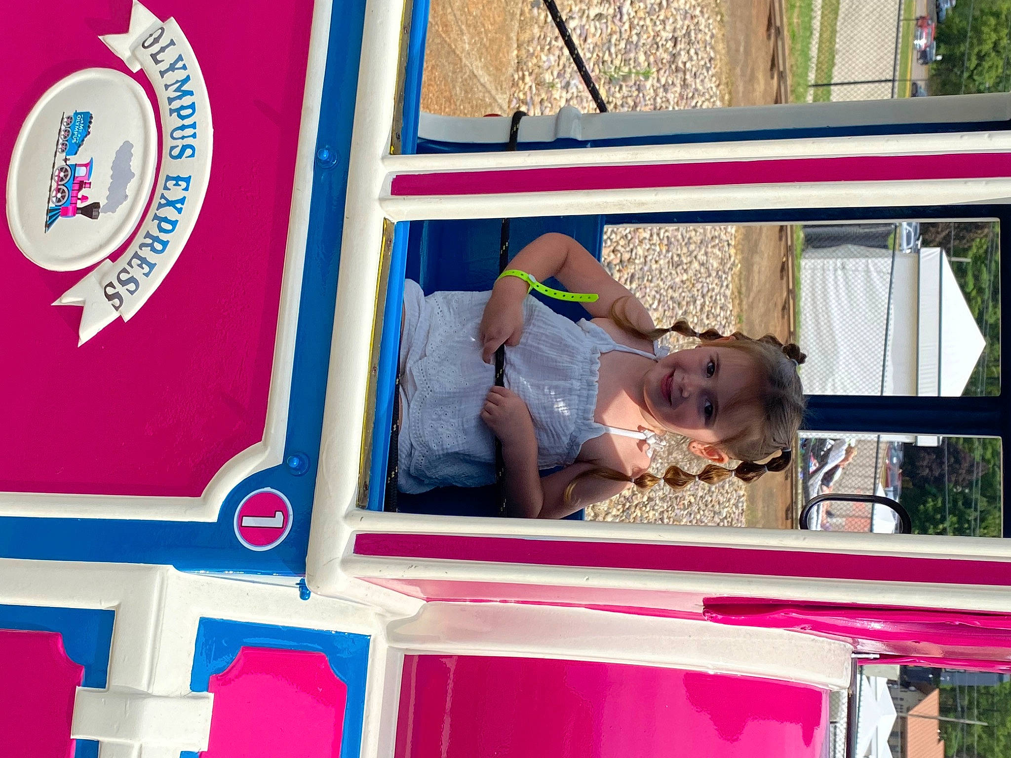 Lilliana is registered to the contest to win money with this photo: amusement_park, child, electric_blue, event, fun, happy, joy, leisure, logo, magenta, person, plant, play, playground, recreation, red, sunglasses, t_shirt, transport, tree