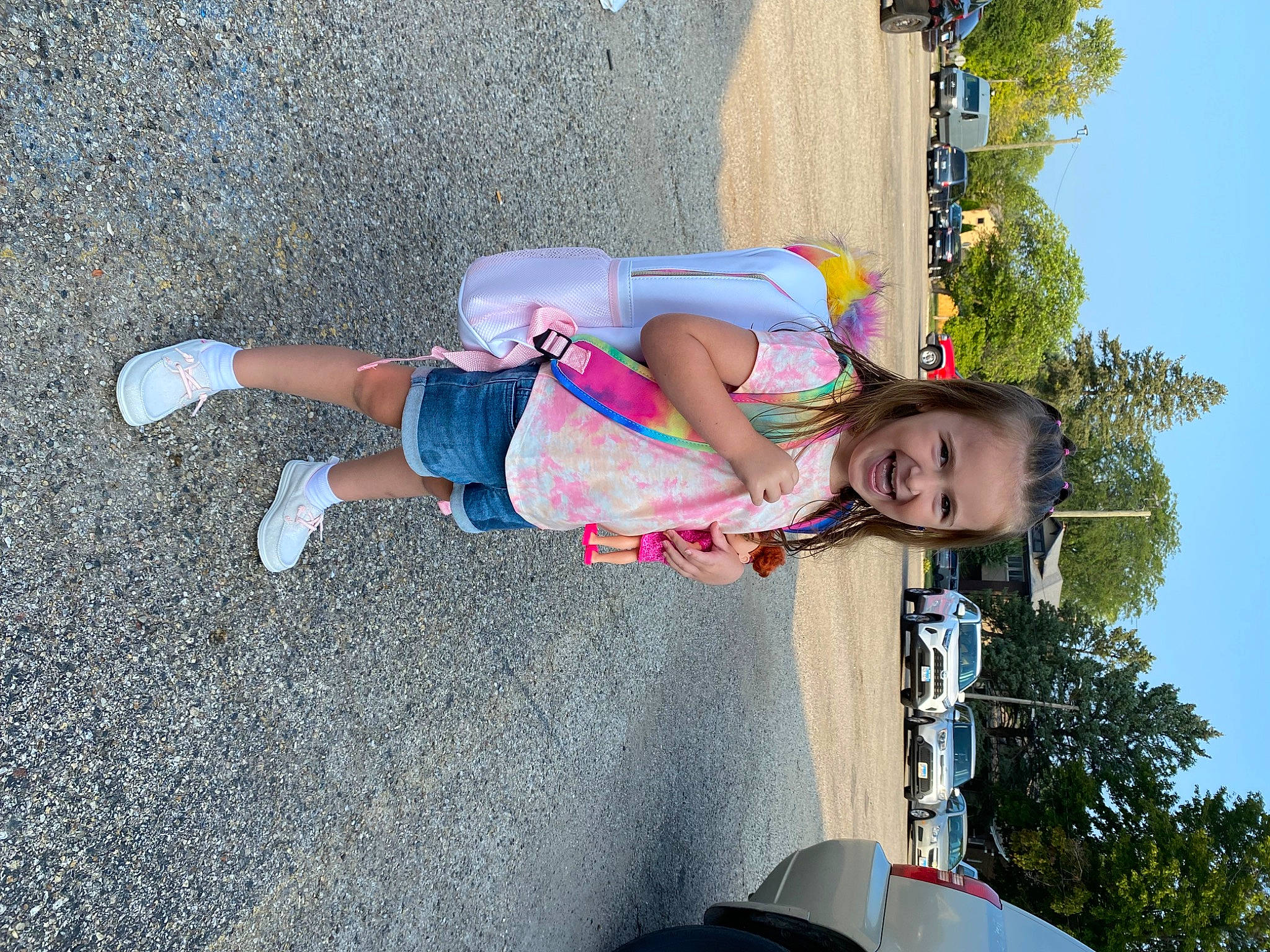 Lilliana is registered to the contest to win money with this photo: asphalt, automotive_window_part, car, child, electric_blue, family_car, fun, happy, joy, leisure, person, recreation, sky, smile, t_shirt, tire, toddler, travel, tree, vehicle_door