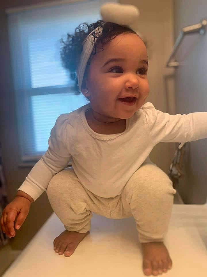 Amia joined the competition — help win amazing prizes! arm, baby_toddler_clothing, barefoot, cheek, child, elbow, finger, floor, flooring, foot, hair_accessory, hand, headpiece, joint, person, shoulder, sitting, skin, sleeve, standing