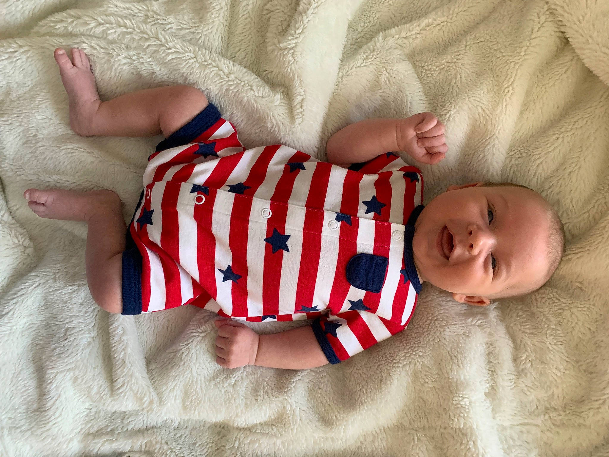 Colby is registered to the contest to win money with this photo: baby, baby_products, baby_sleeping, baby_toddler_clothing, child, comfort, elbow, finger, foot, human_body, human_leg, leg, linens, nail, pattern, person, skin, sleeve, sock, toddler