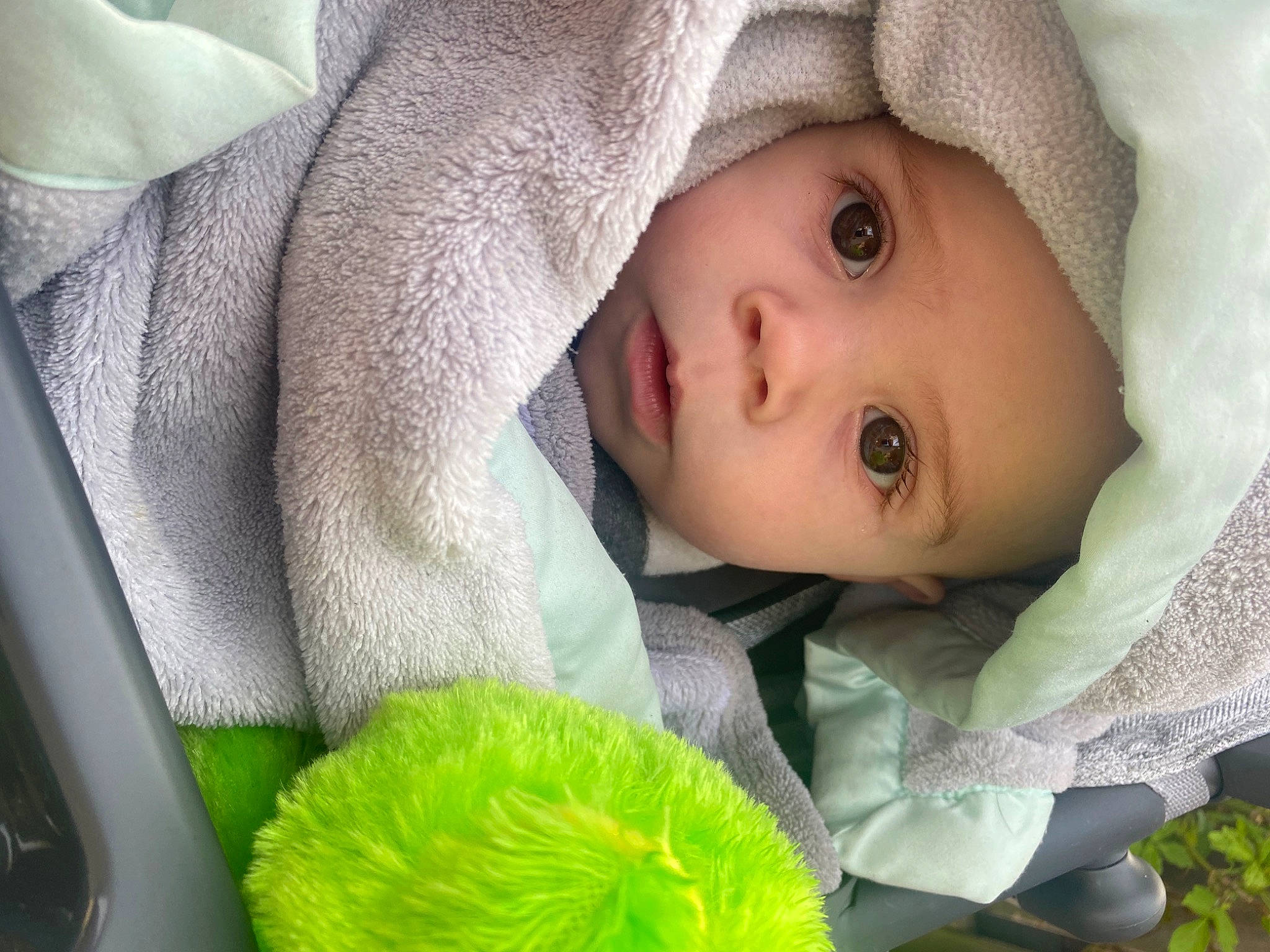 Brycen is registered to the contest to win money with this photo: baby, baby_products, baby_toddler_clothing, cheek, child, comfort, eye, eyelash, grass, green, hat, headwear, iris, linens, lip, nose, person, photograph, product, skin