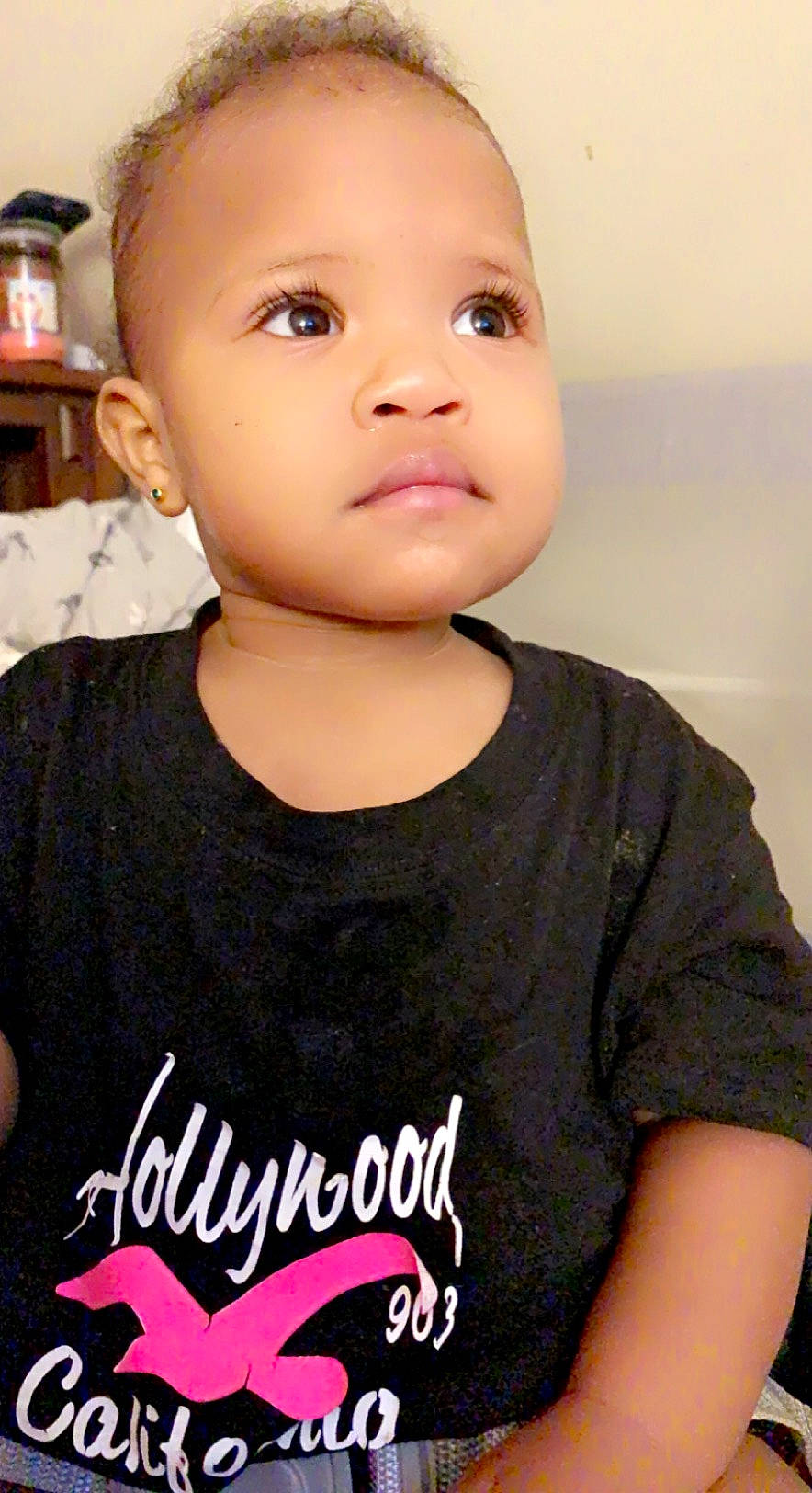 Giselle joined the competition — help win amazing prizes! baby, baby_toddler_clothing, cheek, chin, eyelash, flash_photography, forehead, gesture, happy, jaw, lamp, lip, logo, neck, no_expression, person, portrait_photography, shelf, sleeve, t_shirt