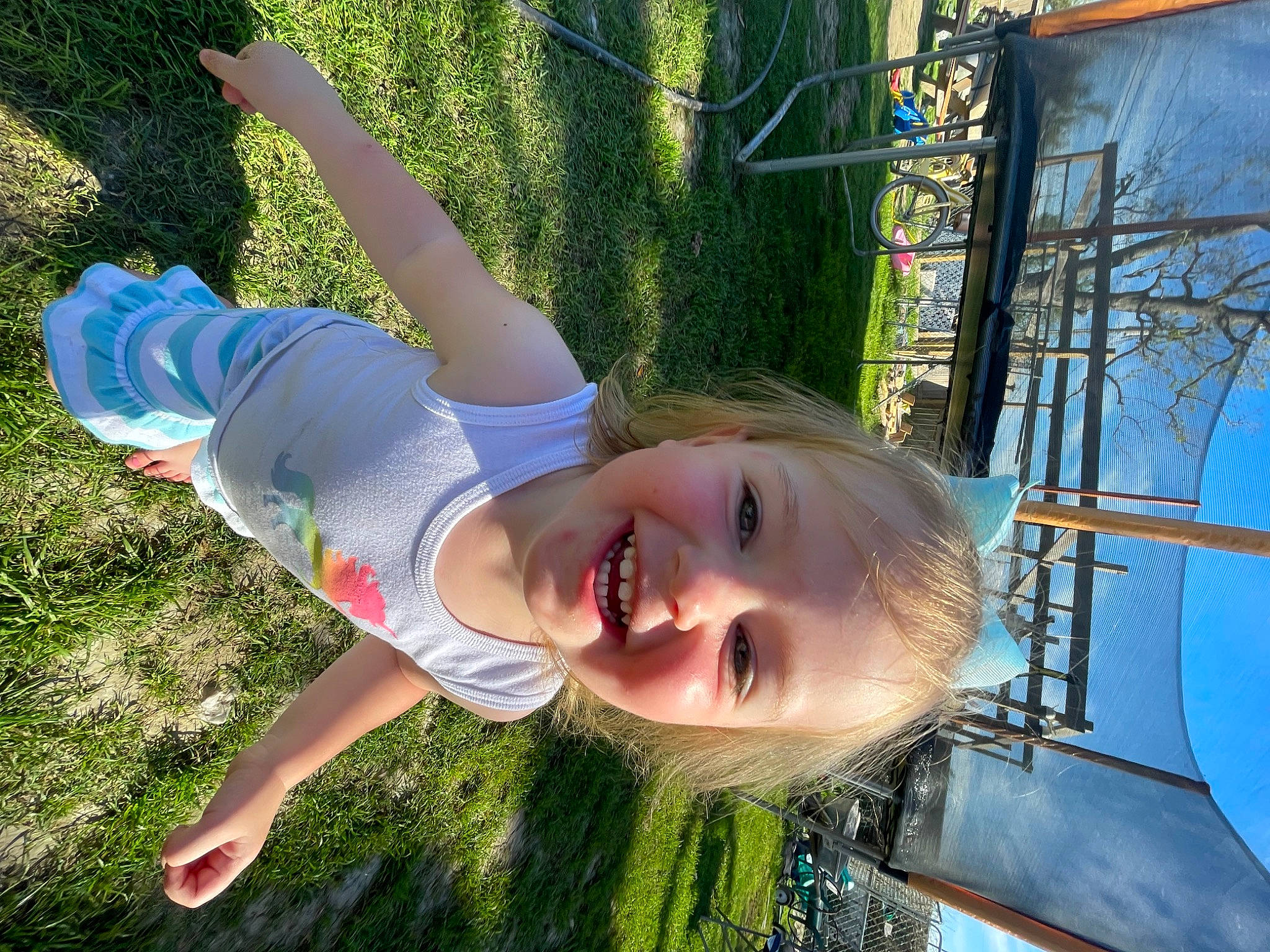 Kaileigh is registered to the contest to win money with this photo: child, electric_blue, fun, grass, happy, joy, leisure, outdoor_play_equipment, people_in_nature, person, plant, recreation, sky, smile, summer, sunlight, swing, toddler, tree, vacation