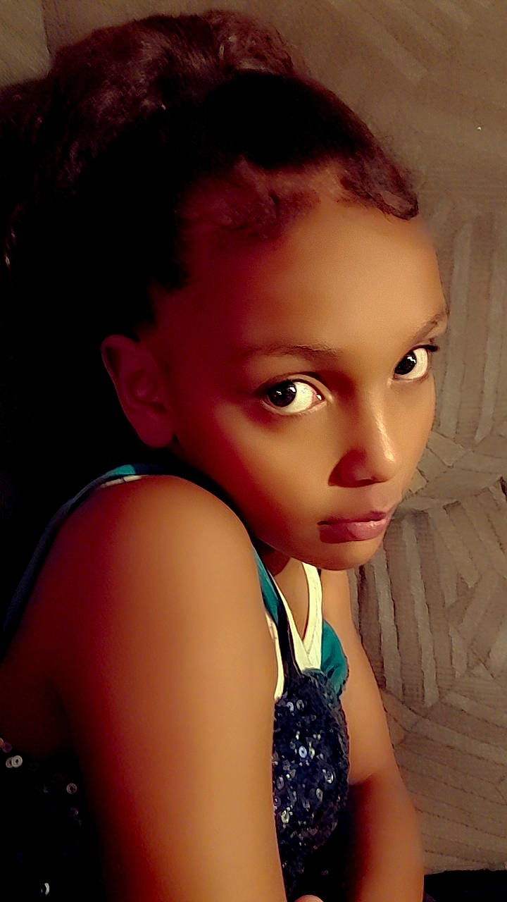 Layla is registered to the contest to win money with this photo: black_hair, brown_hair, cheek, chest, chin, doll, electric_blue, eye, eyebrow, eyelash, flash_photography, happy, head, iris, lip, long_hair, neck, nose, toy, trunk