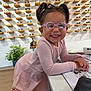 casual, child, counter, cute, eyewear, fashion, girl, glasses, happy, indoor, modern, person, pigtails, pink_clothing, plant, portrait, retail, shop, smiling, sunglasses_display
