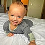 Cree is registered to the contest to win money with this photo: baby, bed, bedroom, bodypart, clothing, crawling, face, finger, furniture, hand, happy, head, indoors, pants, person, photography, portrait, room, sitting, smile