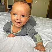 Cree is registered to the contest to win money with this photo: baby, bed, bedroom, blanket, bodypart, crawling, cushion, face, finger, furniture, hand, head, homedecor, indoors, interiordesign, person, photography, portrait, room, sitting