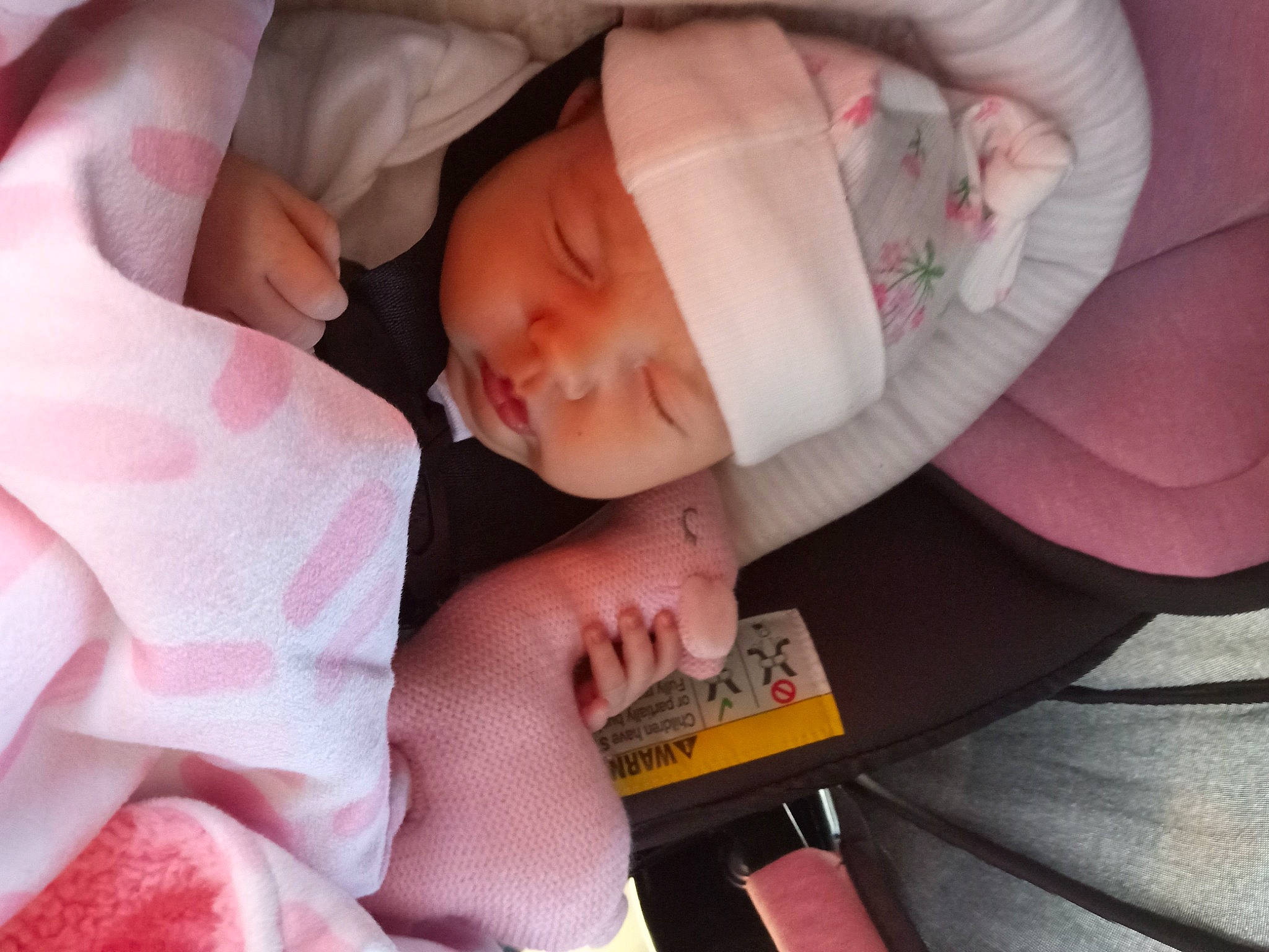 Heartlee is registered to the contest to win money with this photo: arm, baby, baby_sleeping, baby_toddler_clothing, cheek, child, comfort, finger, hand, hat, headgear, headwear, human_body, leg, mouth, nail, person, pink, skin, textile