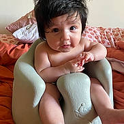Zade is registered to the contest to win money with this photo: baby, bed, blackhair, bodypart, couch, cushion, face, finger, furniture, hair, hand, happy, head, homedecor, indoors, person, photography, portrait, sitting, smile