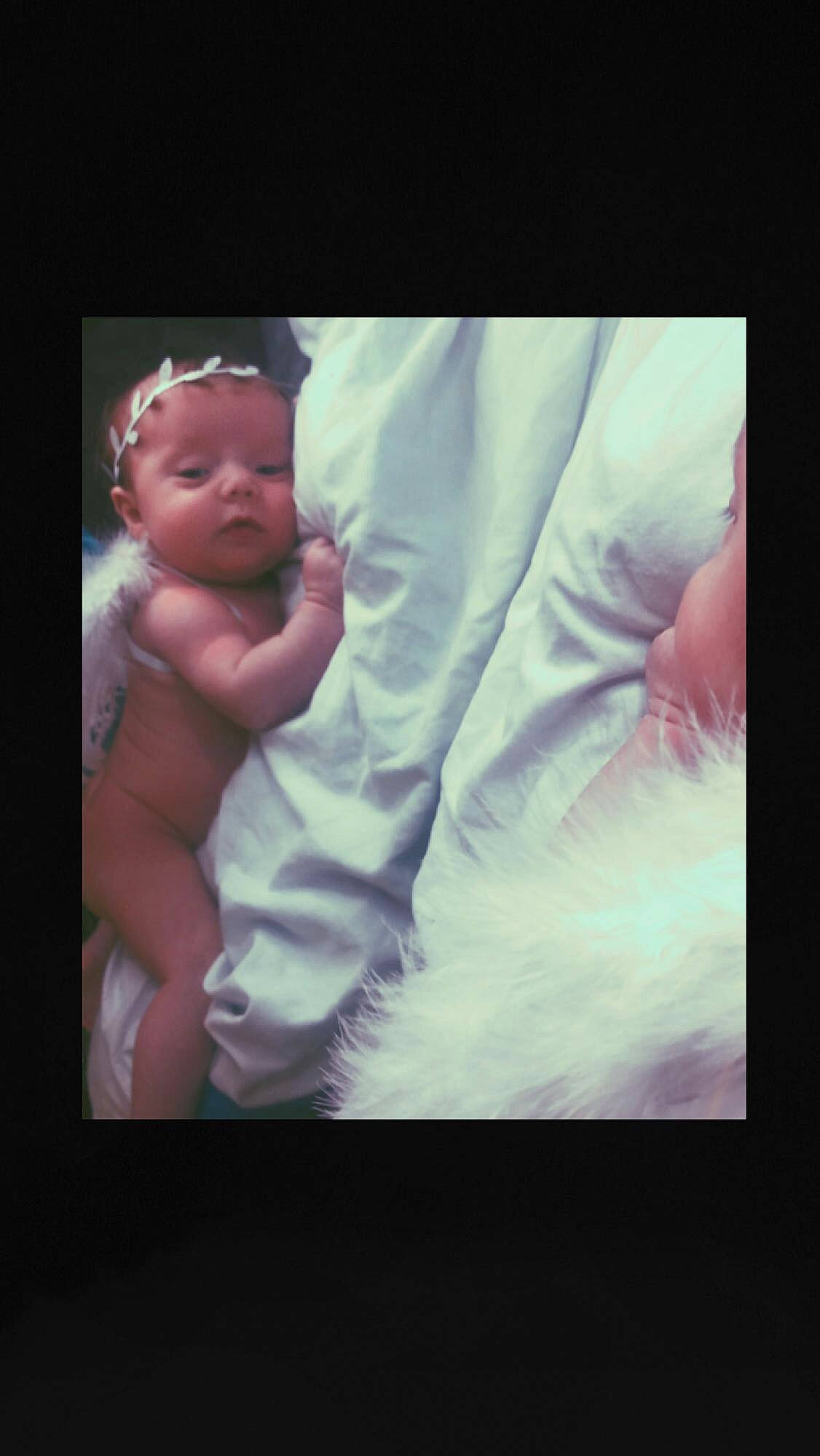 Delilah is registered to the contest to win money with this photo: abdomen, baby, barechested, chest, child, comfort, darkness, finger, flash_photography, flesh, fun, gesture, happy, love, magenta, mouth, person, photo_caption, thumb, toddler