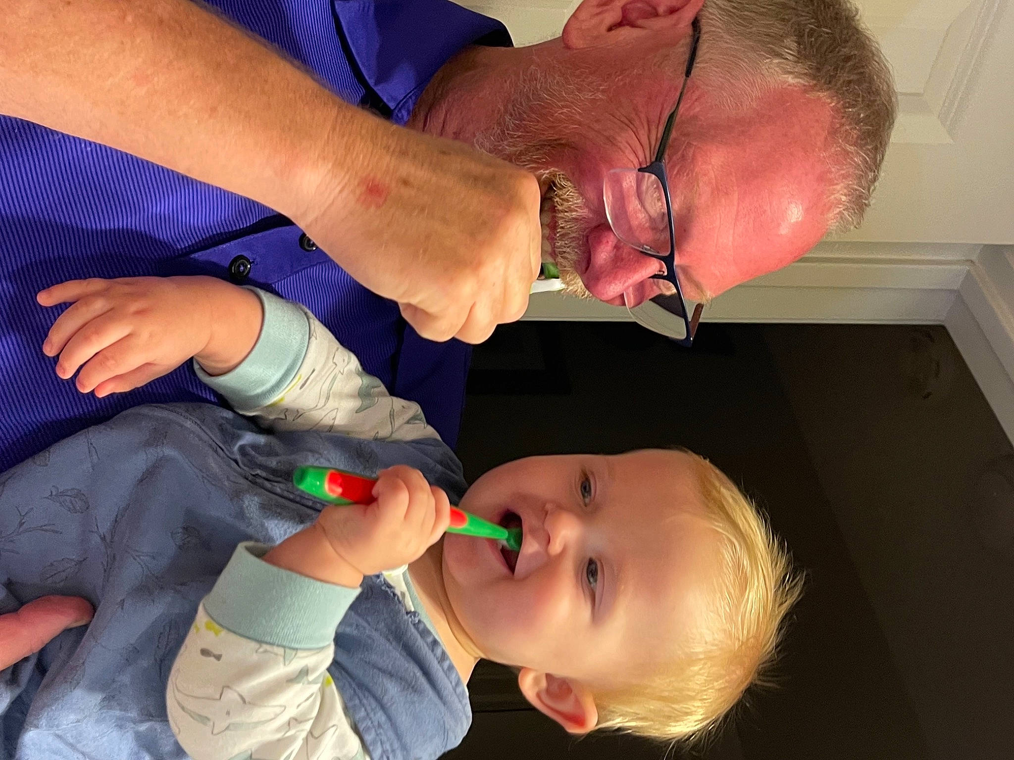 Harrison is registered to the contest to win money with this photo: arm, blue, cheek, ear, eyelash, finger, gesture, hand, happy, jaw, joint, lip, mouth, neck, nose, organ, person, red, skin, smile