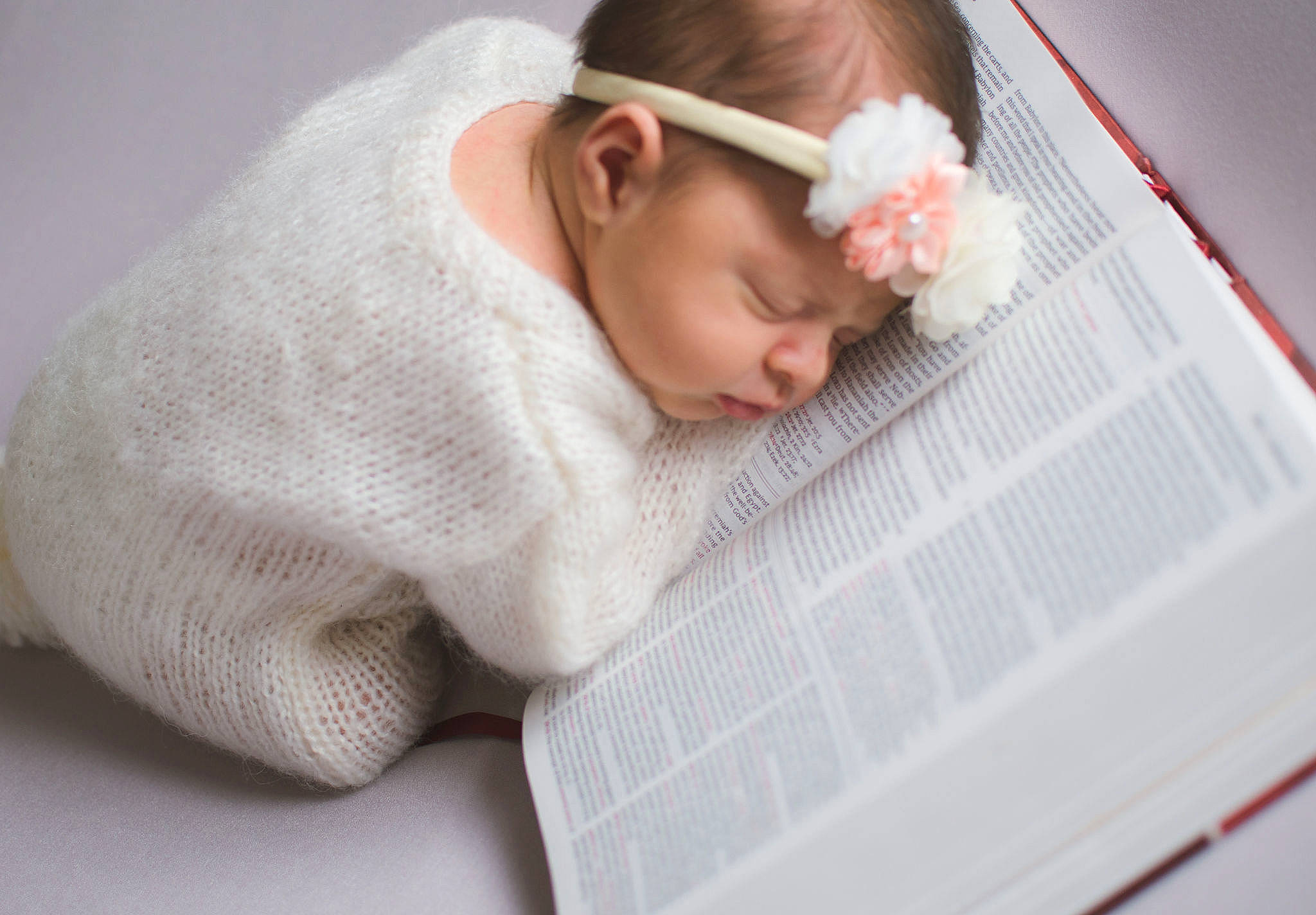 Aurora is registered to the contest to win money with this photo: baby, baby_products, baby_sleeping, baby_toddler_clothing, carmine, child, comfort, fashion_accessory, finger, flooring, flower, hair_accessory, hand, headband, headpiece, headwear, linens, person, petal, sleeve