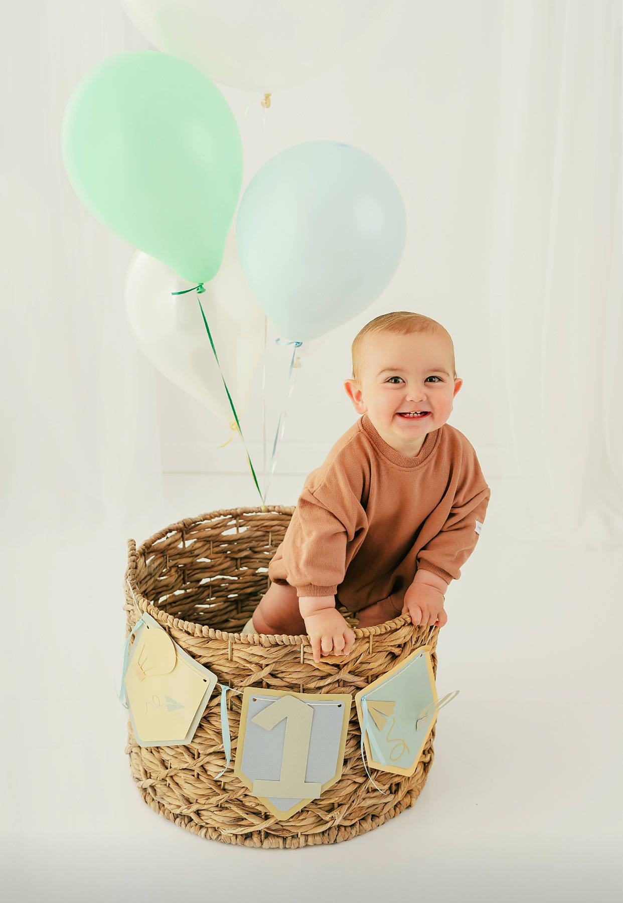 Wilson is registered to the contest to win money with this photo: baby, baby_products, baby_toddler_clothing, balloon, basket, child, event, fashion_accessory, fun, happy, human_body, joy, party_supply, people_in_nature, person, picnic_basket, product, stock_photography, storage_basket, toddler