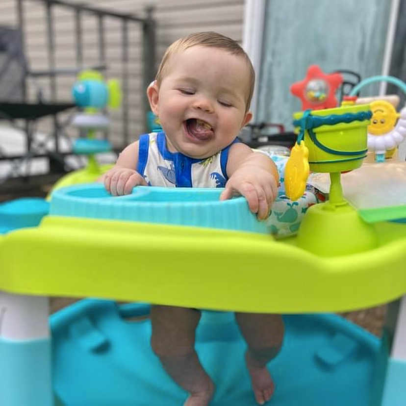 Jonathon joined the competition — help win amazing prizes! baby, bodypart, face, happy, head, laughing, mouth, outdoorplayarea, outdoors, person, photography, plant, playarea, portrait, pottedplant, smile, summer, teeth, toy, water
