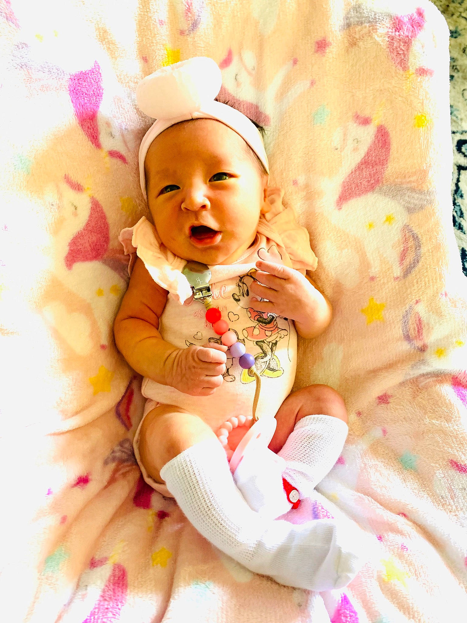 Christina is registered to the contest to win money with this photo: abdomen, baby, baby_sleeping, baby_toddler_clothing, cap, cheek, child, comfort, happy, headband, headgear, headpiece, linens, magenta, peach, person, pink, skin, smile, textile