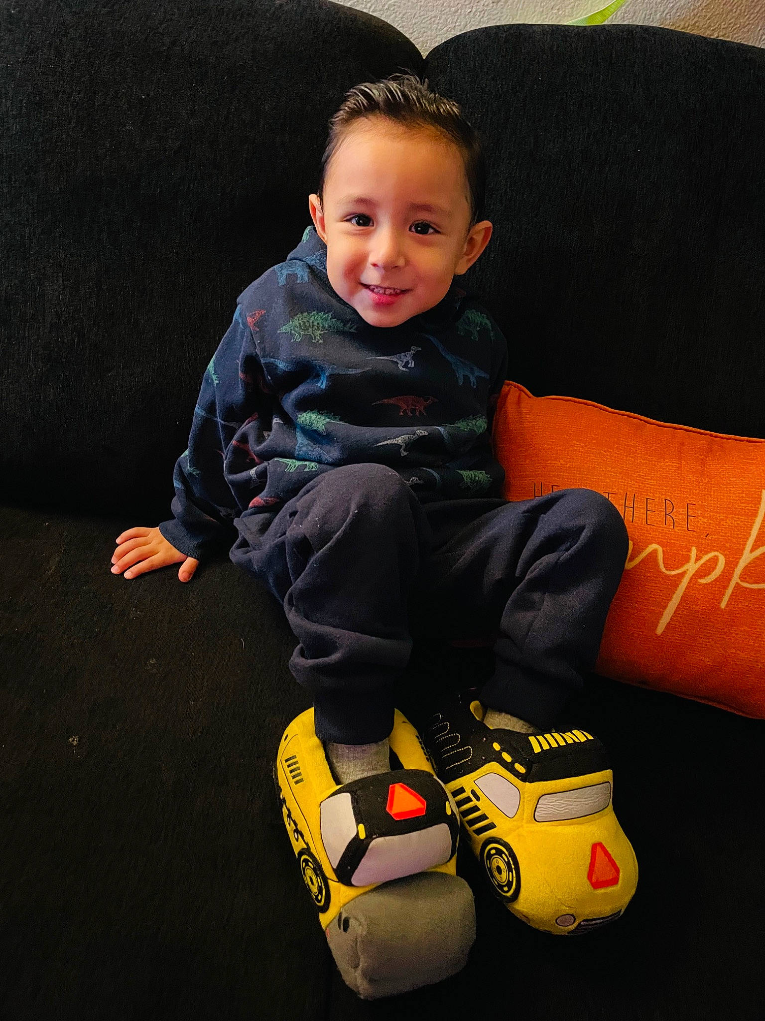 Christian is registered to the contest to win money with this photo: baby, baby_toddler_clothing, child, comfort, couch, electric_blue, face, flash_photography, flooring, fun, human_leg, joy, knee, lap, leg, orange, person, sitting, sleeve, smile