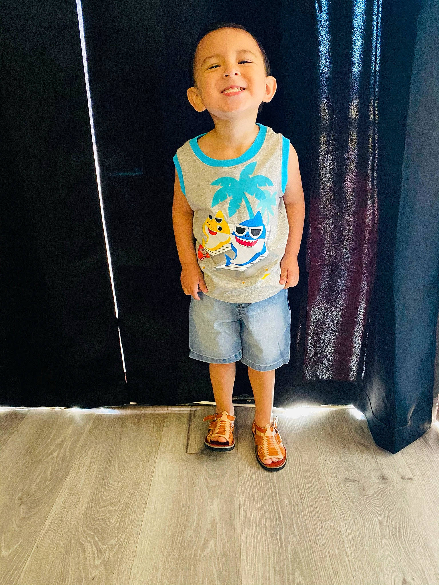 Christian is registered to the contest to win money with this photo: baby_toddler_clothing, cool, denim, flash_photography, floor, flooring, happy, joy, knee, leg, leisure, person, shorts, sleeve, smile, sportswear, standing, street_fashion, t_shirt, toddler