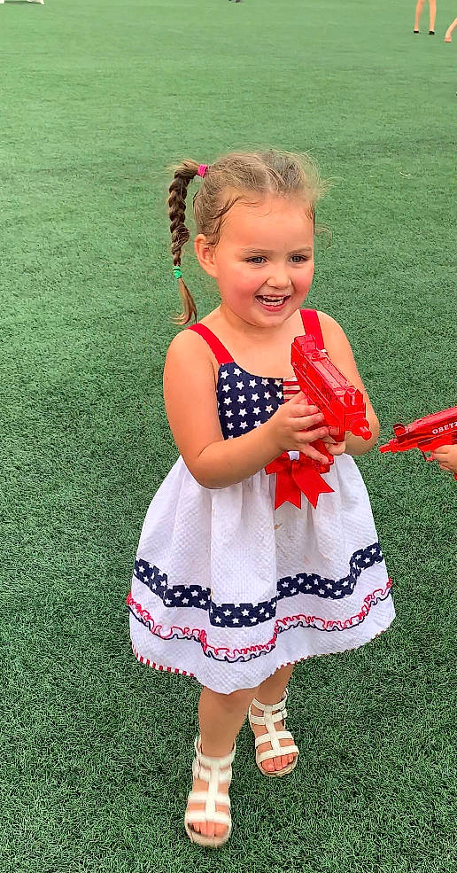 Thea joined the competition — help win amazing prizes! baby_toddler_clothing, child, day_dress, dress, facial_expression, fun, gesture, grass, hairstyle, happy, joy, pattern, people_in_nature, person, pink, play, recreation, shoe, sleeve, smile