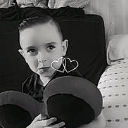 Rossé participe au concours pour gagner de l'argent avec cette photo : child, boy, plush_toy, mickey_mouse, couch, pillows, black_and_white, hugging, smiling, indoors, cute, decor, portrait, face, hands, toy, childhood, cozy, seated, expression