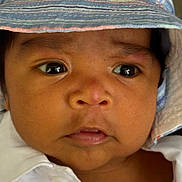 Navy joined the competition — help win amazing prizes! baby, infant, child, face, portrait, close_up, wide_eyes, serious_expression, bonnet, striped_hat, clothing, white_shirt, head, eyes, nose, mouth, skin, indoor, photography, adorable
