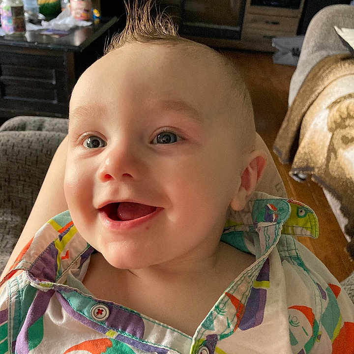 Osiris is registered to the contest to win money with this photo: baby, clothing, coat, computerhardware, cushion, electronics, face, happy, hardware, head, homedecor, monitor, person, photography, portrait, screen, selfie, smile, text, tv