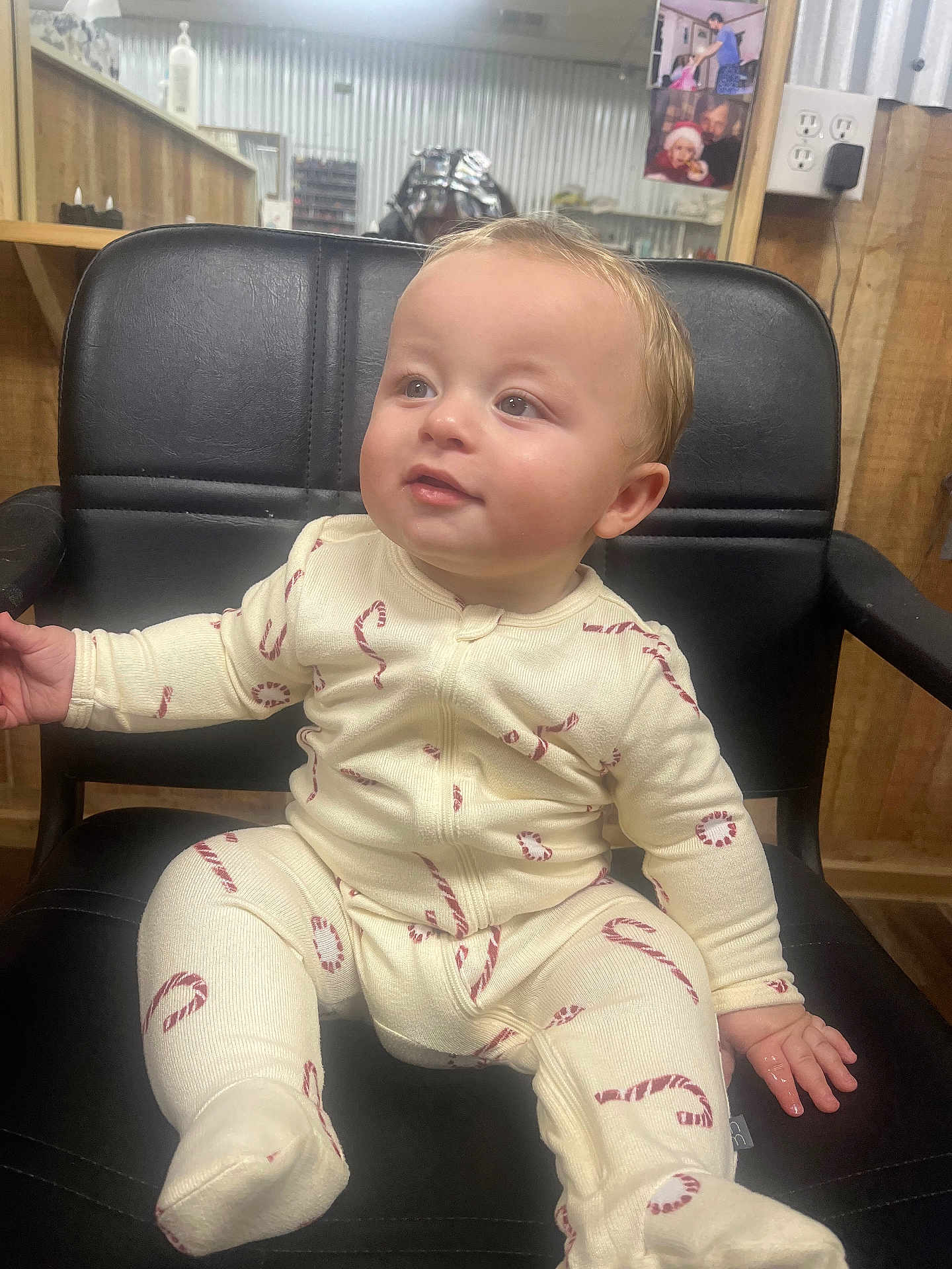 Mccally joined the competition — help win amazing prizes! baby, child, onesie, candy_cane, chair, black_chair, indoor, wooden_wall, mirror, photograph, curly_hair, cute, infant, sitting, looking_away, cozy, home, portrait, smiling, hand