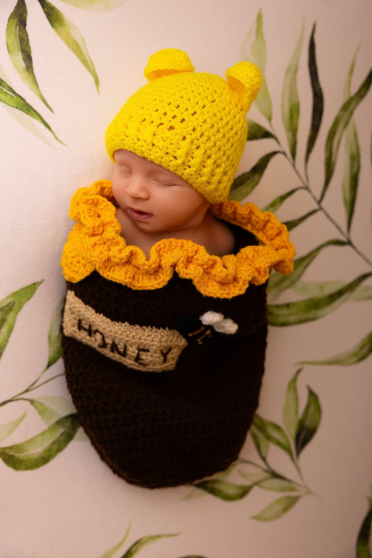 Ernest is registered to the contest to win money with this photo: accessories, baby, bag, beanie, bonnet, cap, clothing, doll, face, flower, glove, hat, head, newborn, pattern, person, photography, plant, portrait, toy